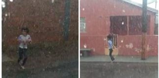 Menina brinca na chuva em Santa Eudóxia